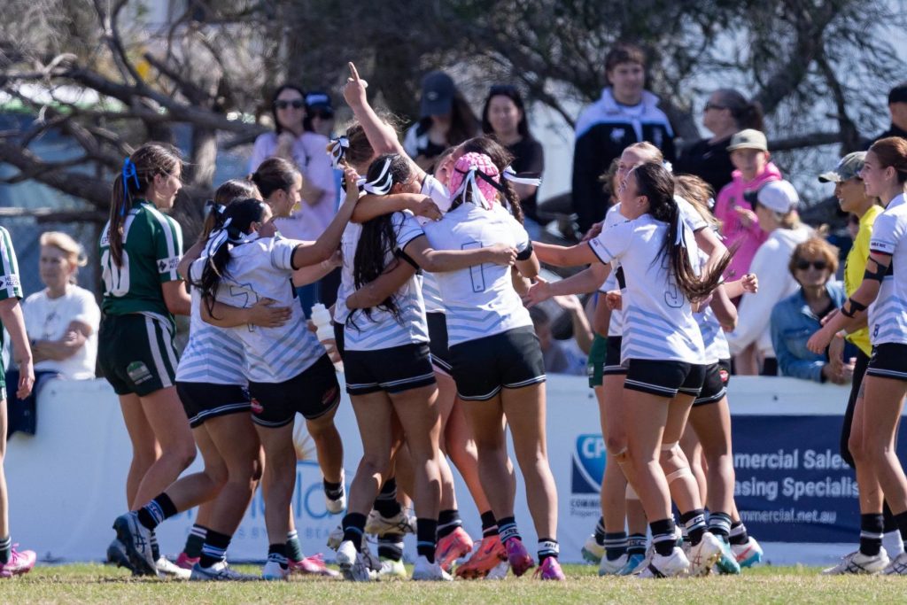 Cronulla Caringbah Sharks U16s women’s team celebrating a try