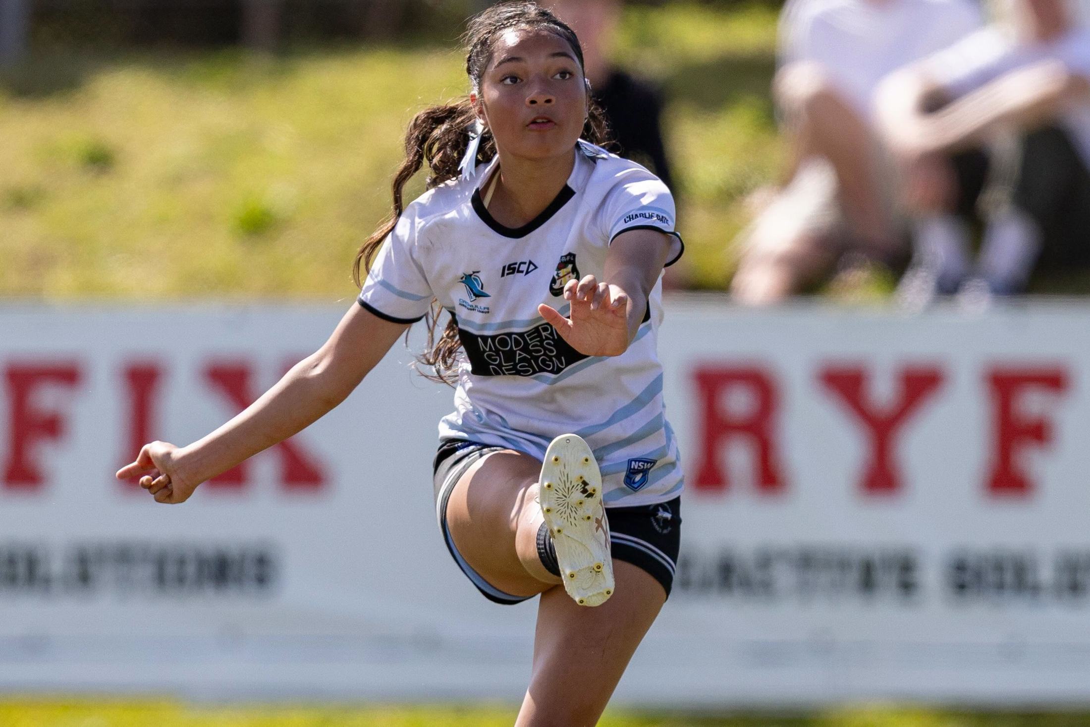 Cronulla Caringbah Sharks U16s women’s player kicking the ball